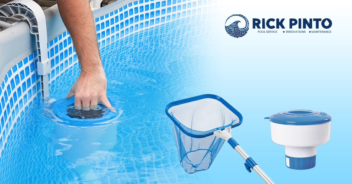 A hand adjusting a pool skimmer in an above-ground pool, shown with a leaf skimmer net and a floating chemical dispenser for pool maintenance.
